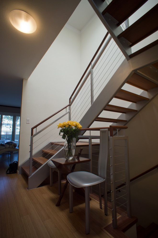 Staircase - mid-sized modern wooden u-shaped open staircase idea in Denver