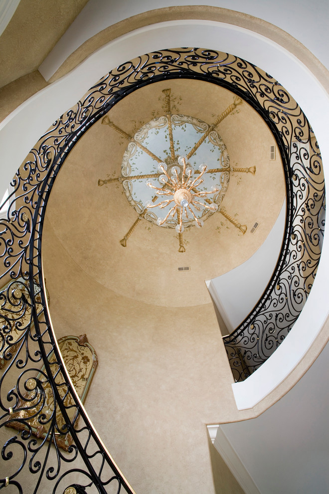Inspiration for a huge timeless wooden curved staircase remodel in Chicago with painted risers