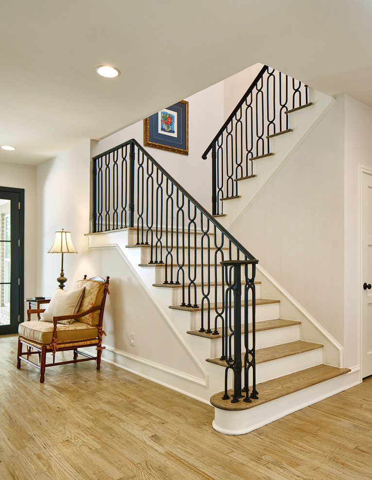 Traditional staircase with feature lighting.