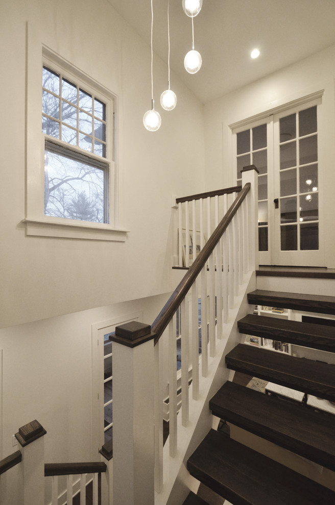 Staircase - mid-sized cottage wooden u-shaped open and wood railing staircase idea in Chicago