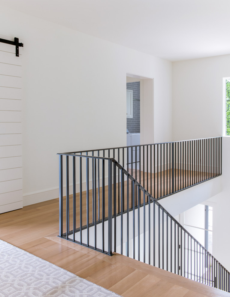 Staircase - large mediterranean wooden l-shaped metal railing staircase idea in Dallas with wooden risers
