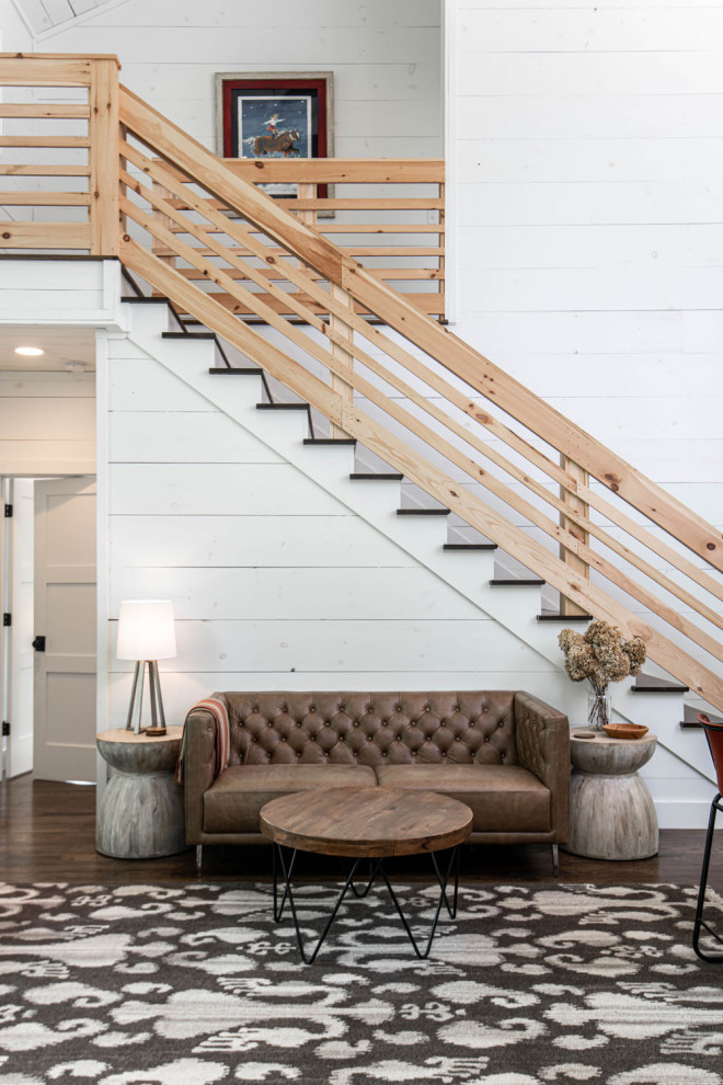 Staircase - rustic wooden straight wood railing and shiplap wall staircase idea in Other with wooden risers