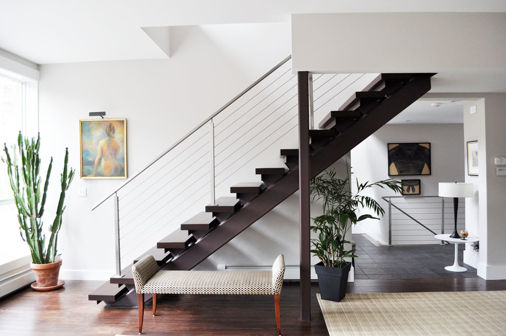 Inspiration for a contemporary wood straight staircase in Portland Maine with open risers and feature lighting.