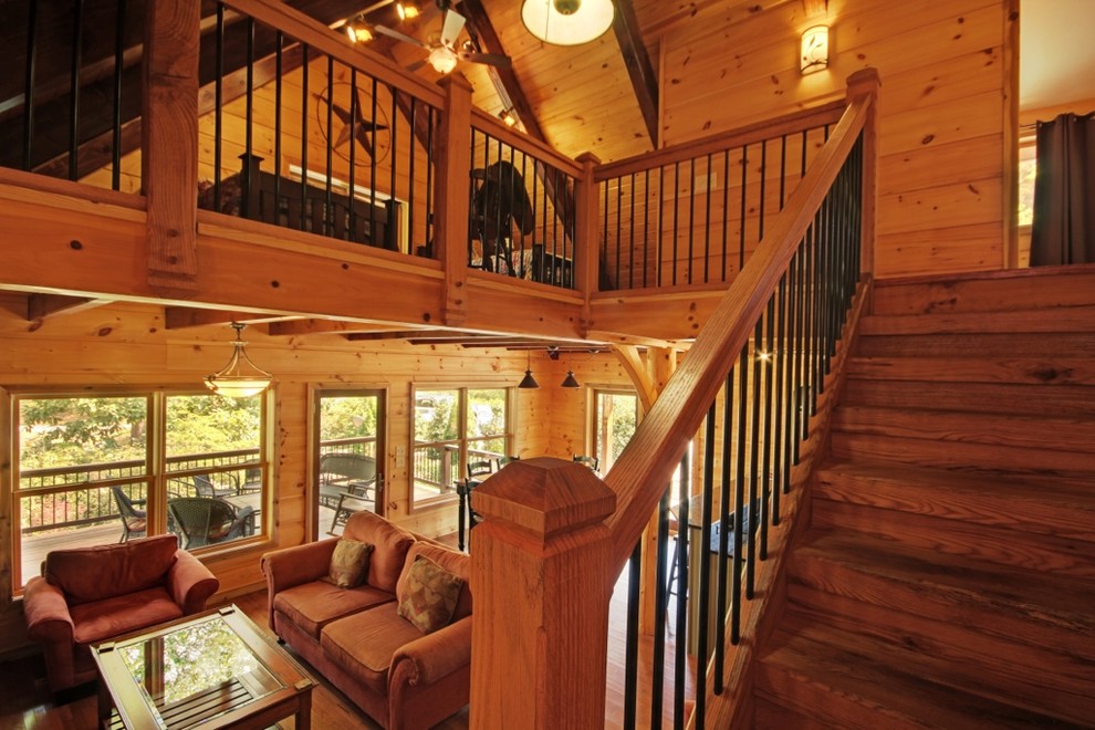Ejemplo de escalera en L bohemia de tamaño medio con escalones de madera y contrahuellas de madera