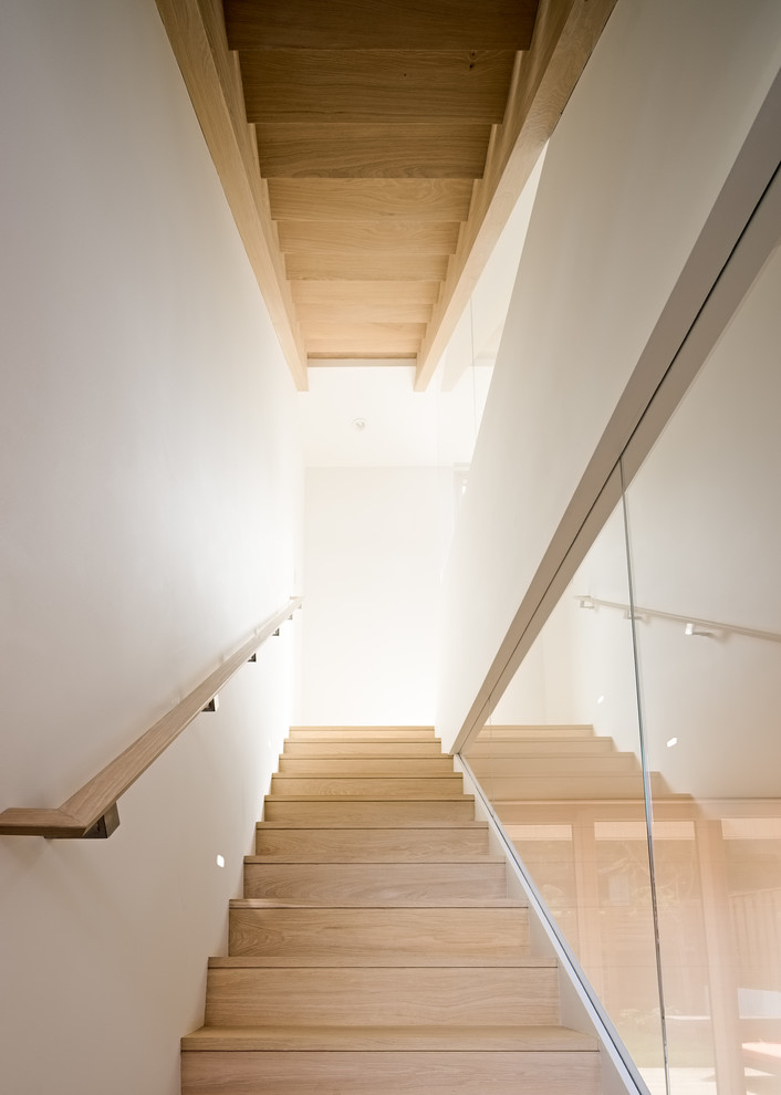 Design ideas for a medium sized modern wood straight staircase in San Francisco with open risers.