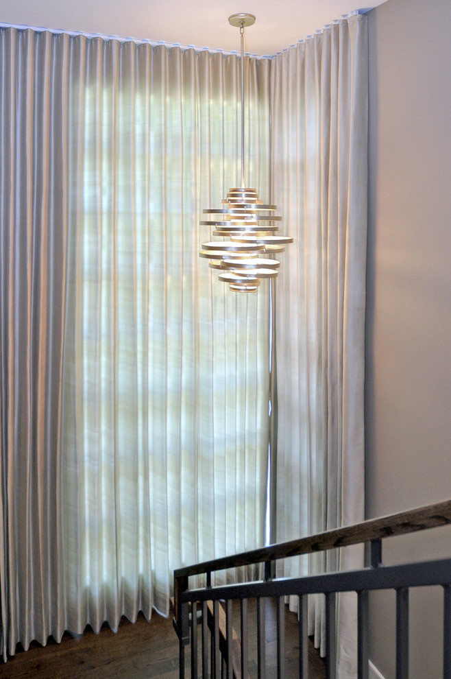 Transitional wooden u-shaped staircase photo in Calgary