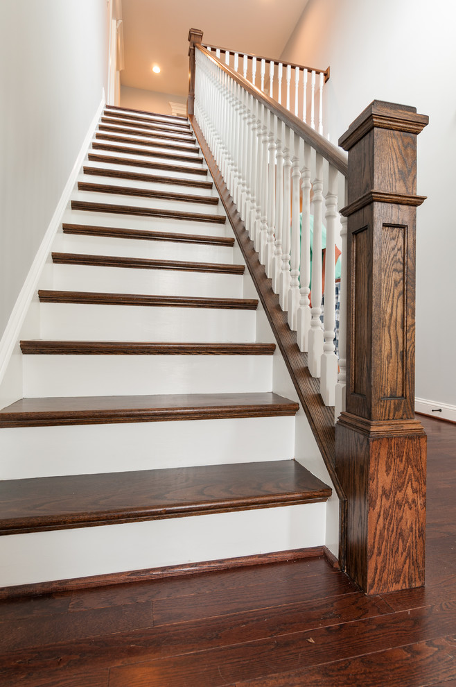 This is an example of a medium sized traditional wood straight wood railing staircase in Richmond with wood risers.