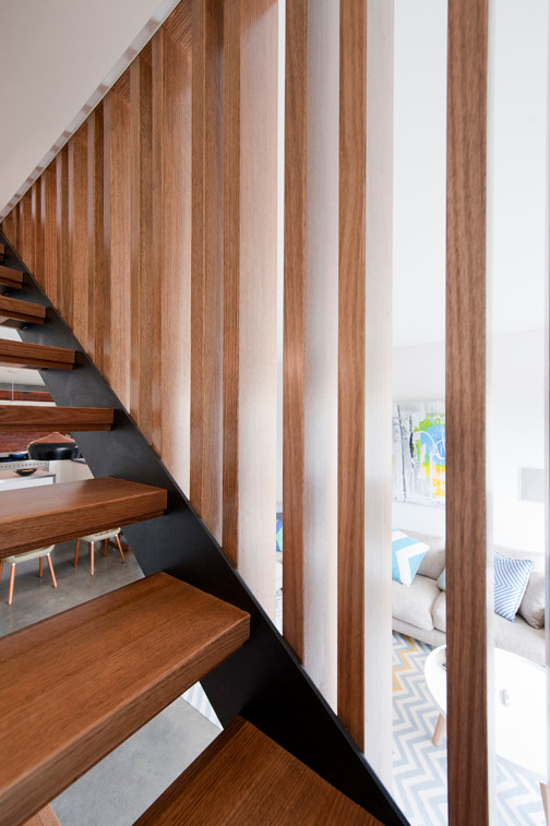 Example of a mid-sized trendy wooden straight open staircase design in Melbourne
