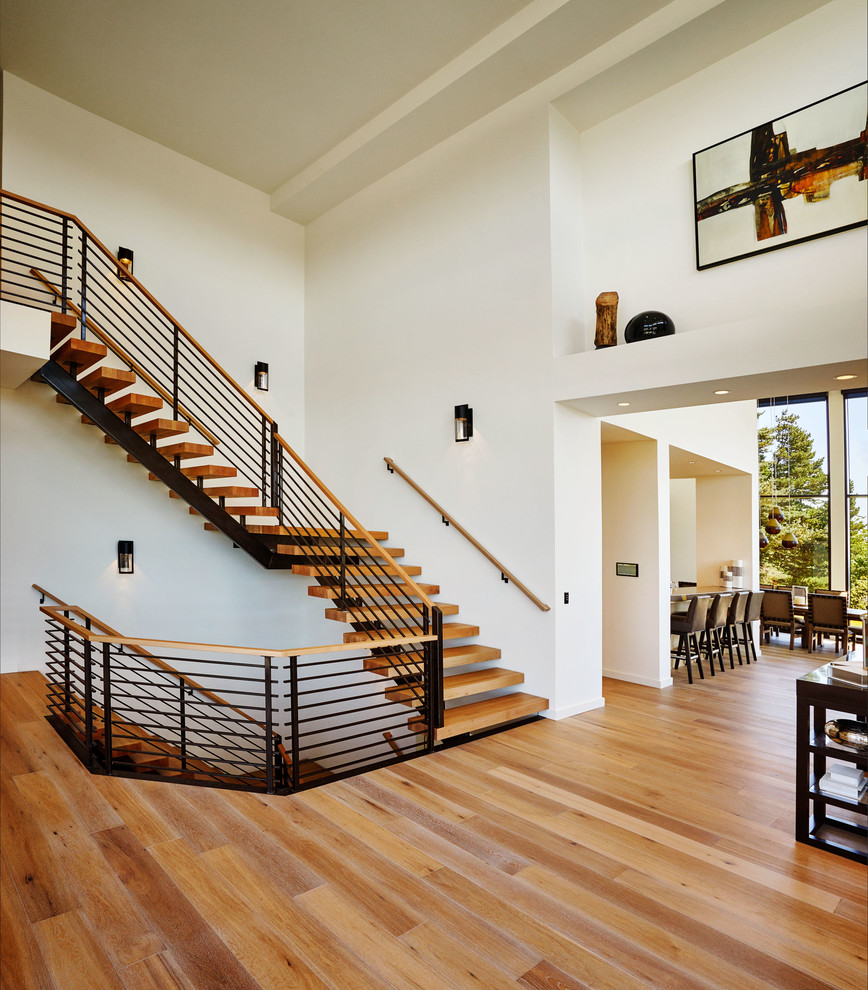 Idées déco pour un grand escalier sans contremarche moderne en L avec des marches en bois.