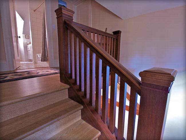 Design ideas for a large traditional wood l-shaped staircase in San Francisco with wood risers.
