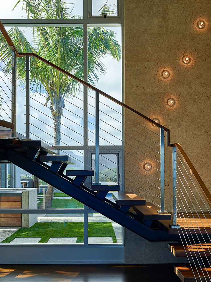 Diseño de escalera en L minimalista de tamaño medio sin contrahuella con escalones de madera y barandilla de cable