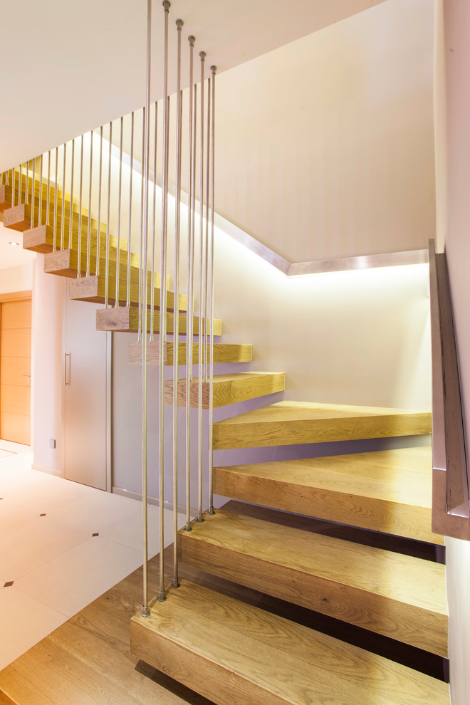 Inspiration for a contemporary floating staircase spindle in Other with open risers.