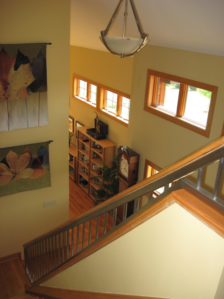 Inspiration for a mid-sized craftsman wooden straight mixed material railing staircase remodel in DC Metro with wooden risers