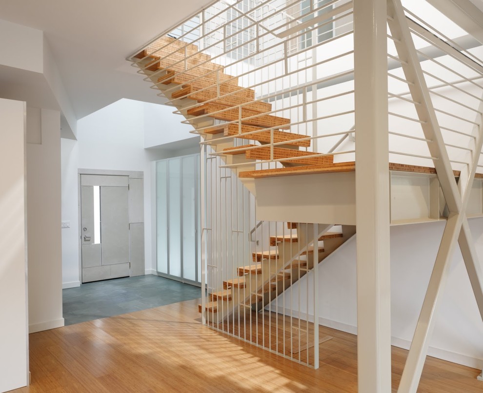 Idée de décoration pour un escalier design avec palier.