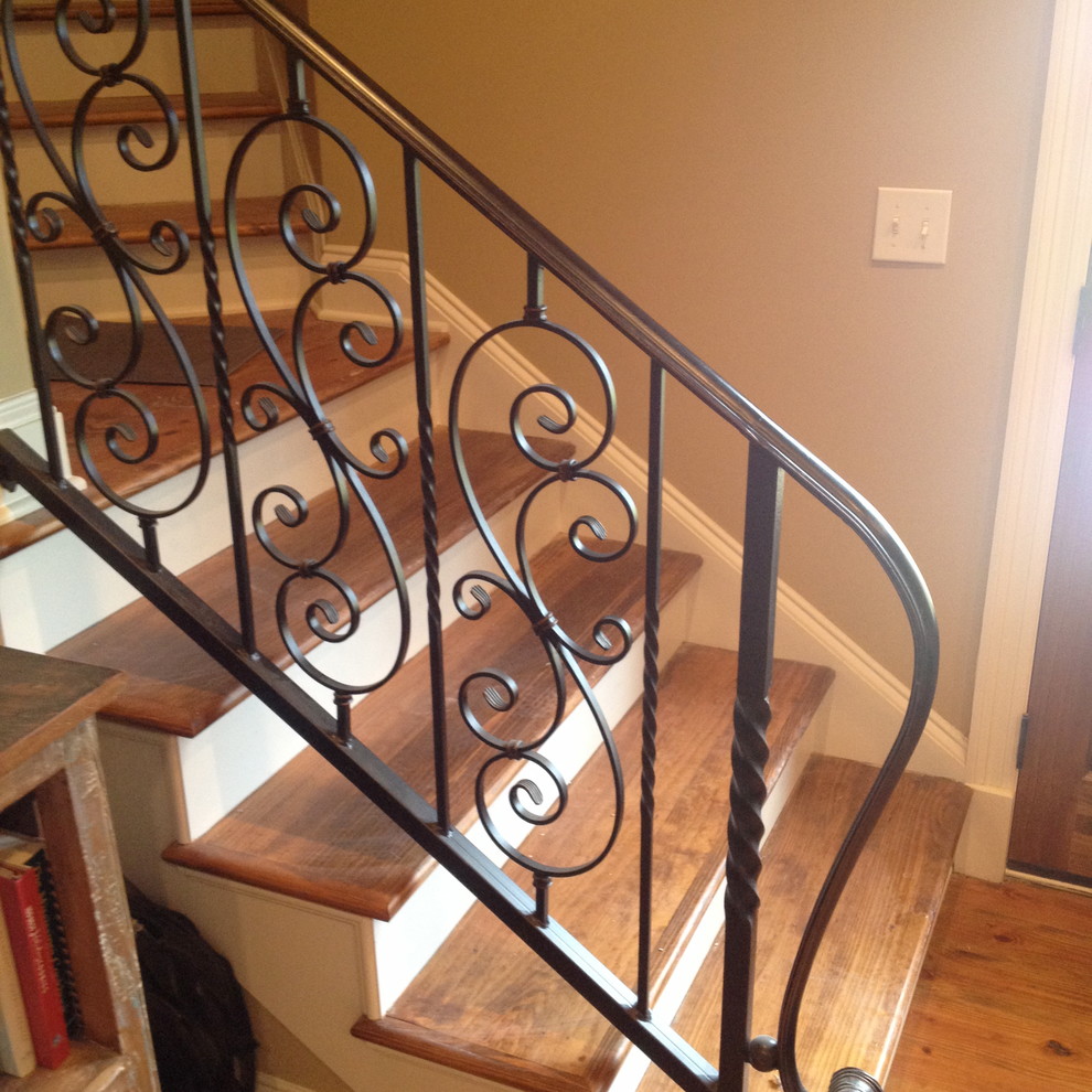 Example of a small classic wooden straight staircase design in Jackson with painted risers