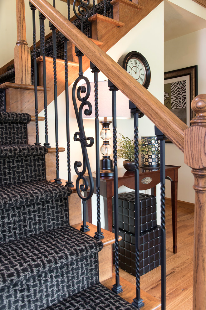 Staircase - mid-sized traditional carpeted l-shaped mixed material railing staircase idea in Milwaukee with carpeted risers