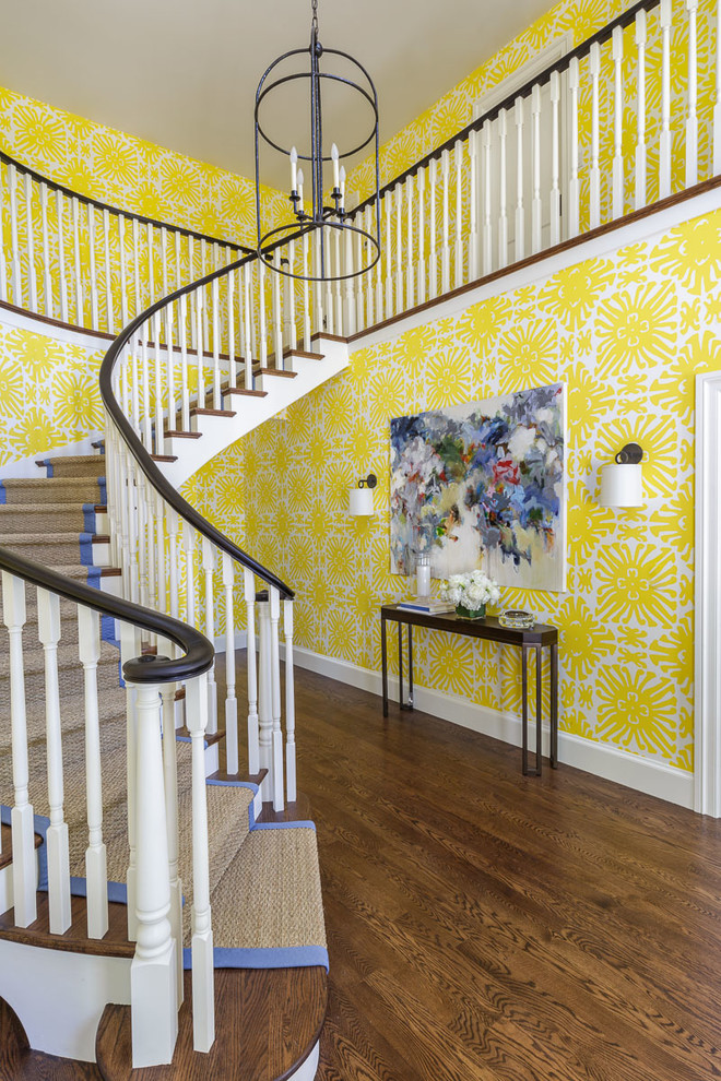 Traditional carpeted curved wood railing staircase in San Francisco with carpeted risers.