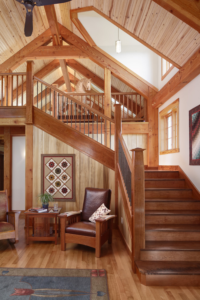 Inspiration pour un escalier craftsman en L avec des marches en bois et des contremarches en bois.