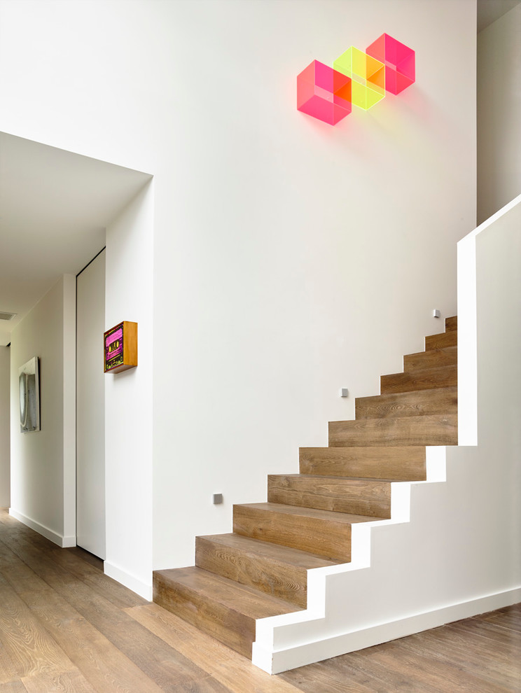 Photo of a medium sized contemporary wood straight staircase in Melbourne with wood risers.