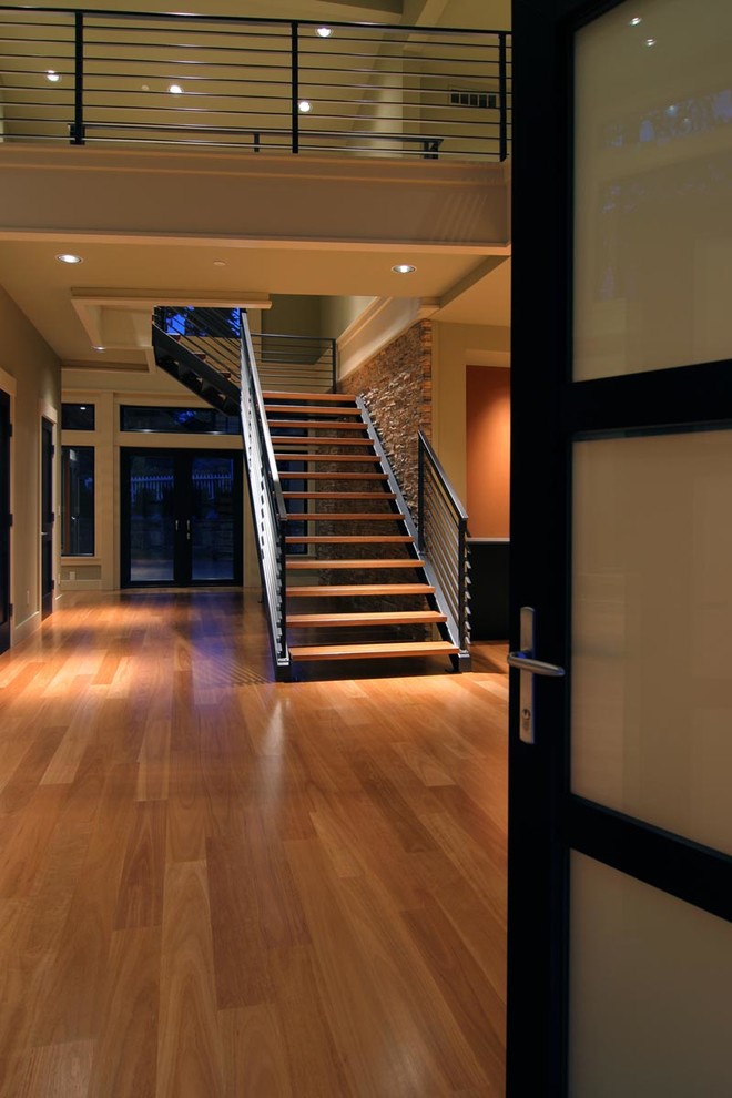 Inspiration pour un escalier sans contremarche design en L de taille moyenne avec des marches en bois.