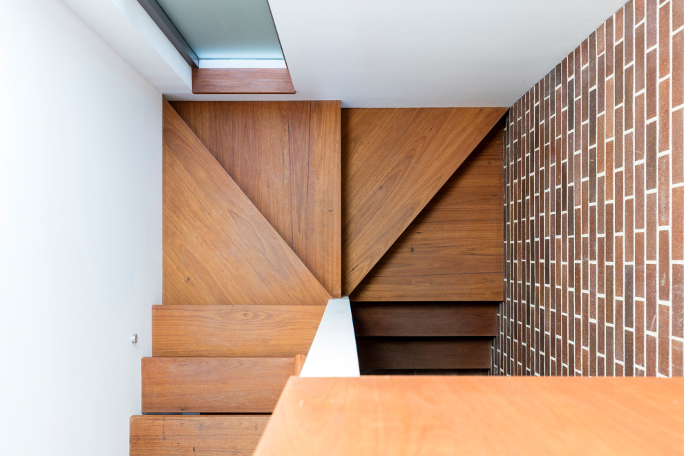 Mittelgroße Retro Treppe in U-Form mit Beton-Setzstufen in Sydney