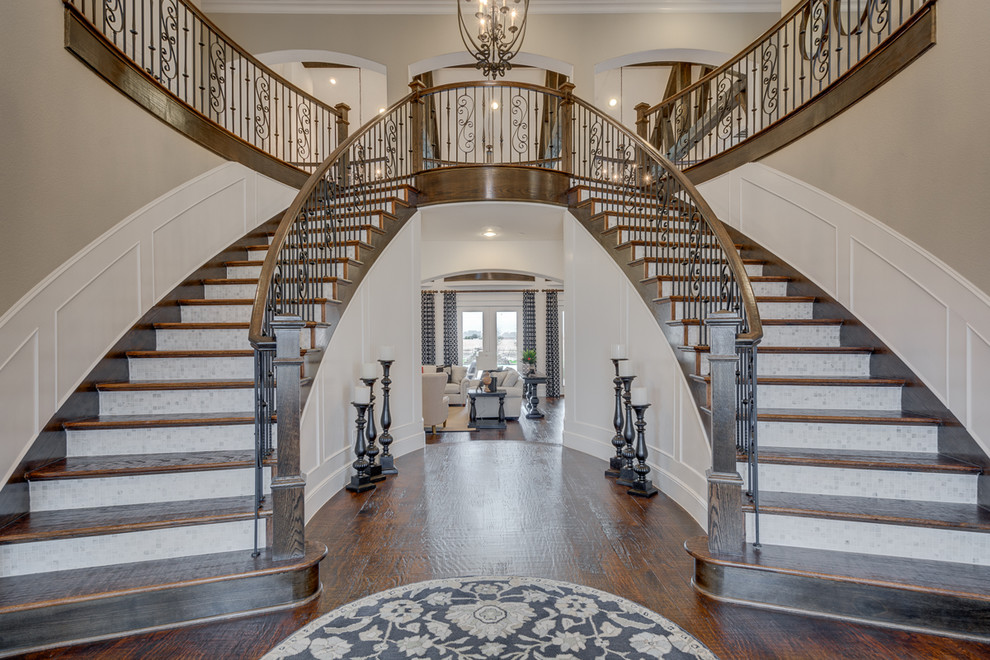 Photo of a traditional wood curved staircase in Dallas with tiled risers.