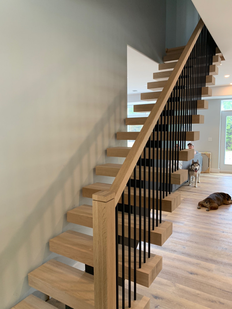 Inspiration pour un escalier sans contremarche droit design avec des marches en bois et un garde-corps en matériaux mixtes.