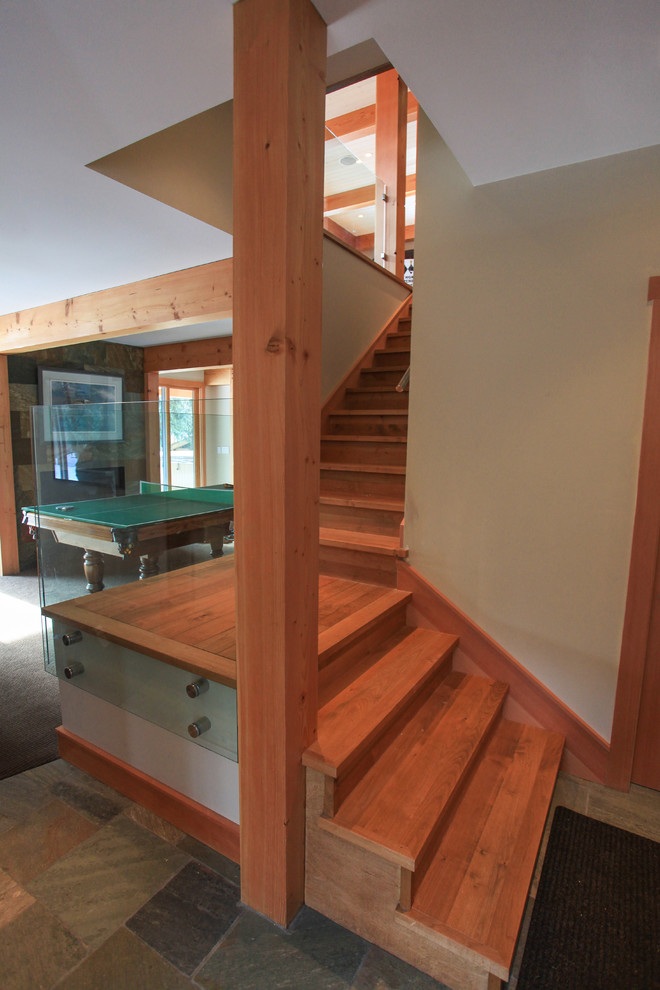 Mid-sized transitional wooden l-shaped staircase photo in Vancouver with wooden risers