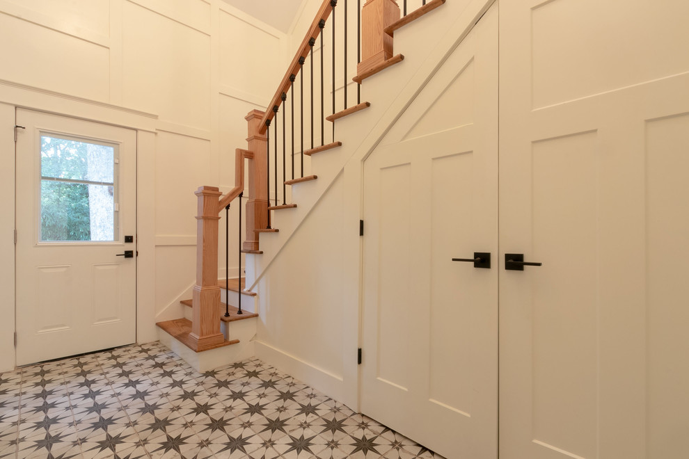 Inspiration pour un escalier peint droit rustique de taille moyenne avec des marches en bois, un garde-corps en matériaux mixtes et rangements.