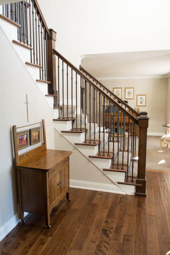 Inspiration for a medium sized classic carpeted l-shaped wood railing staircase in Minneapolis with carpeted risers.