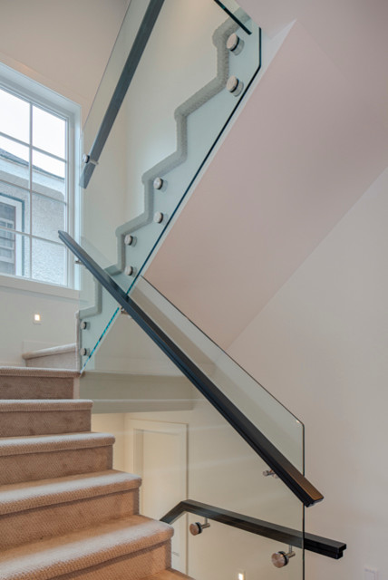 Inspiration for a mid-sized contemporary carpeted u-shaped staircase remodel in Vancouver