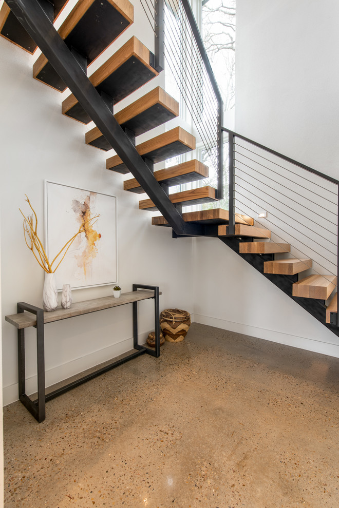 Свежая идея для дизайна: угловая лестница среднего размера в стиле ретро с деревянными ступенями и металлическими перилами без подступенок - отличное фото интерьера