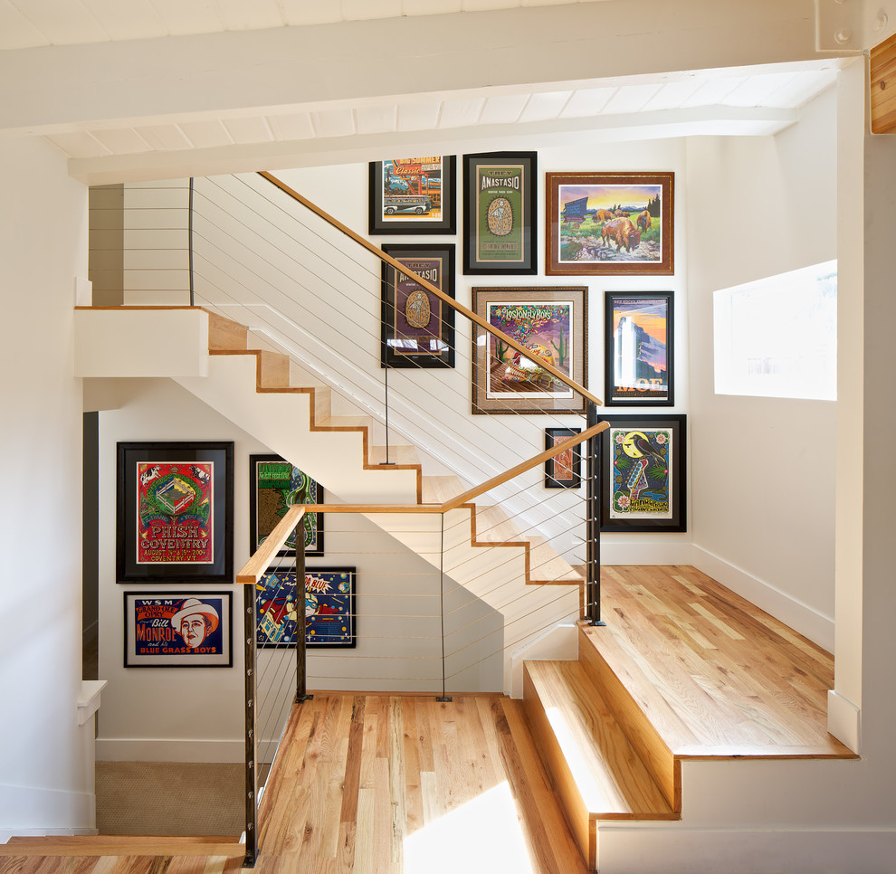 Inspiration for a mid-sized contemporary wooden u-shaped staircase remodel in Denver with wooden risers