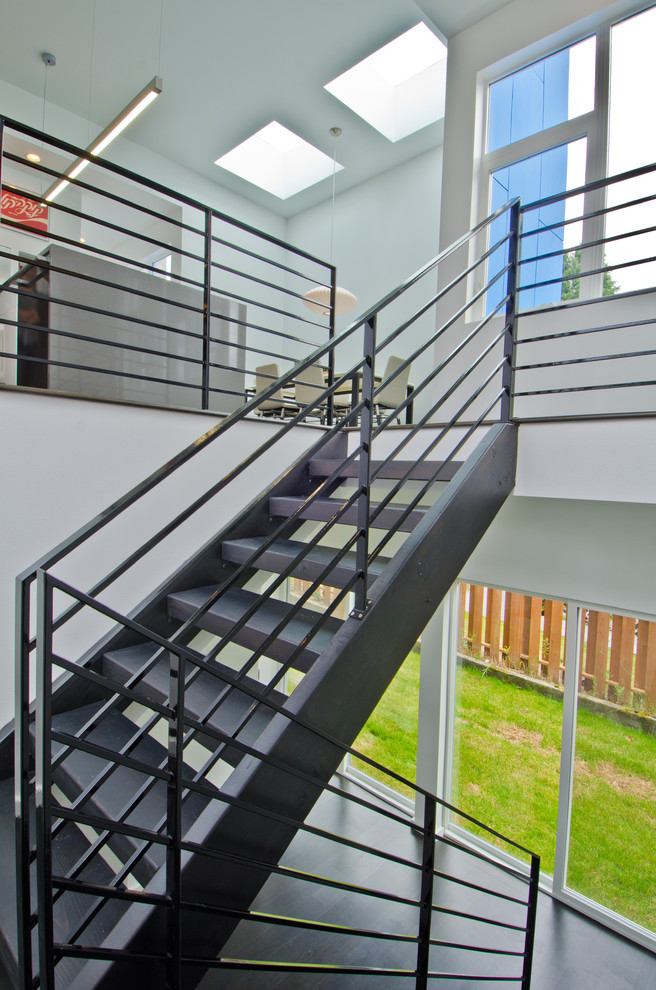 This is an example of a modern floating staircase in Seattle with open risers.