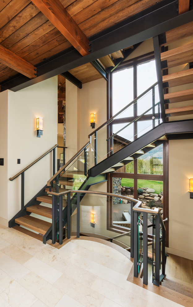 Inspiration for a large contemporary wood floating wood railing staircase in Denver with open risers.