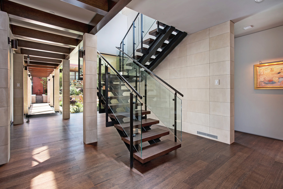 Inspiration for a contemporary staircase in Orange County with open risers.