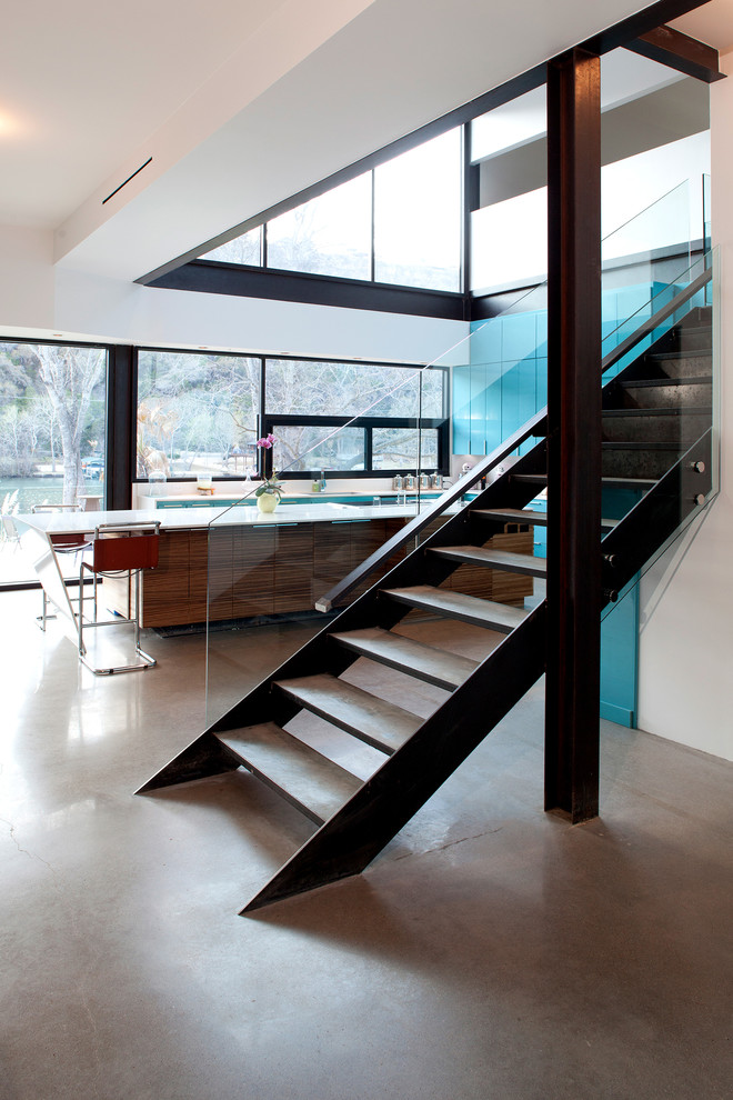 Design ideas for a modern concrete staircase in Austin with open risers.