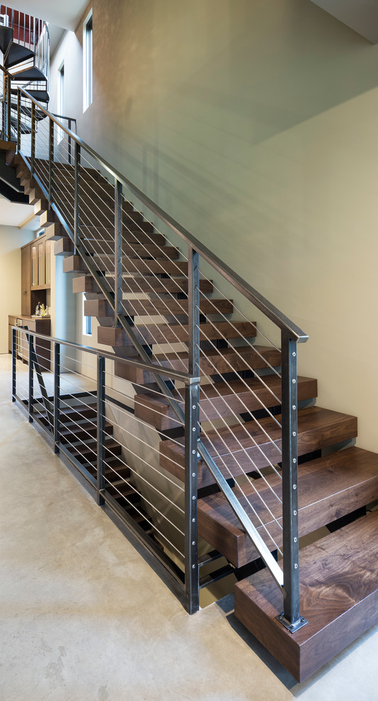 Photo of a small modern wood floating staircase in Minneapolis with open risers.