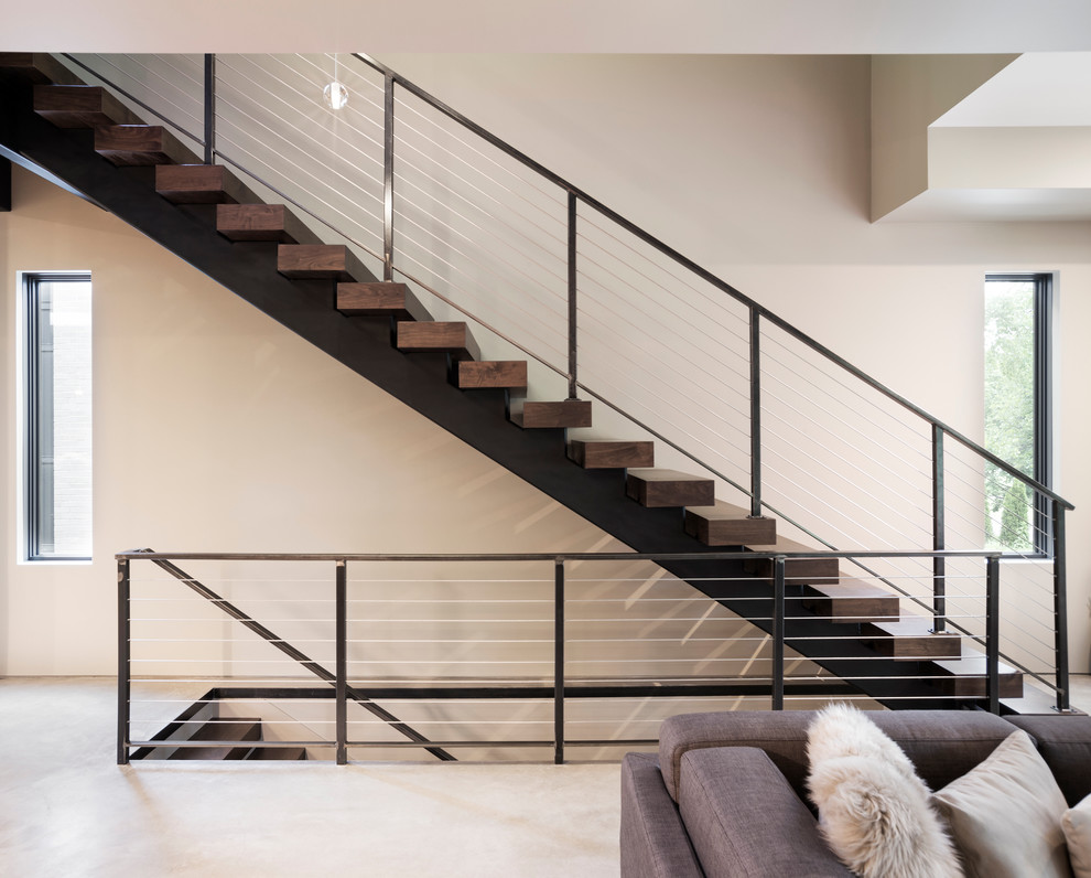 Idée de décoration pour un petit escalier sans contremarche flottant minimaliste avec des marches en bois.