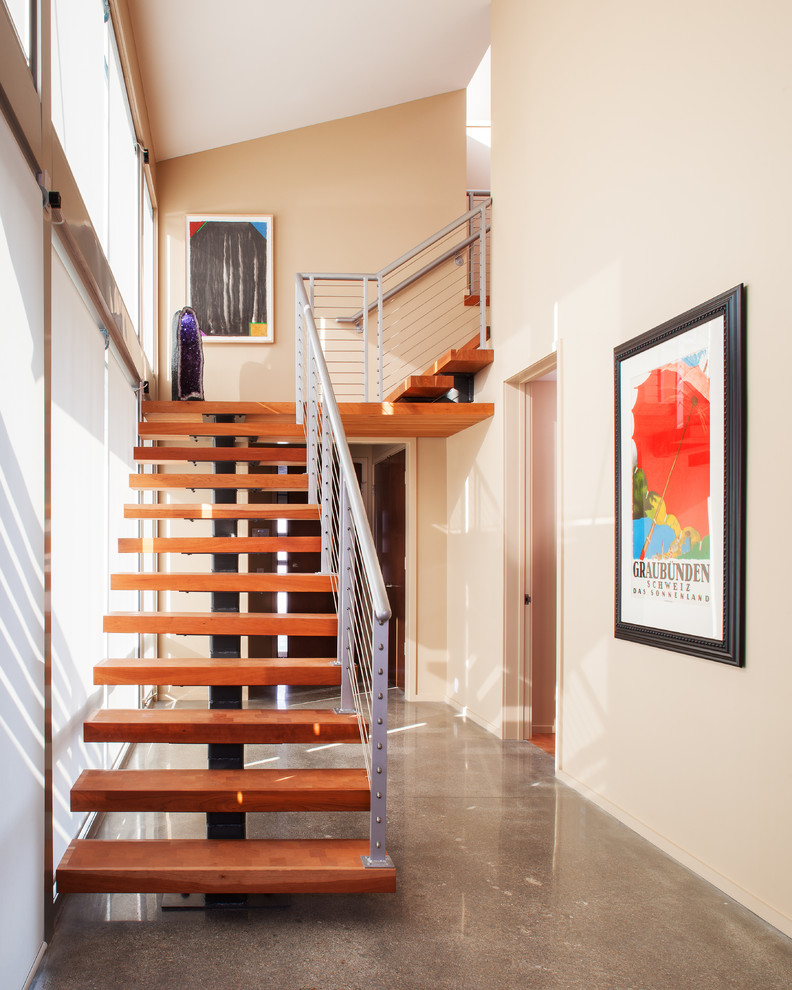 Diseño de escalera en L contemporánea sin contrahuella con escalones de madera