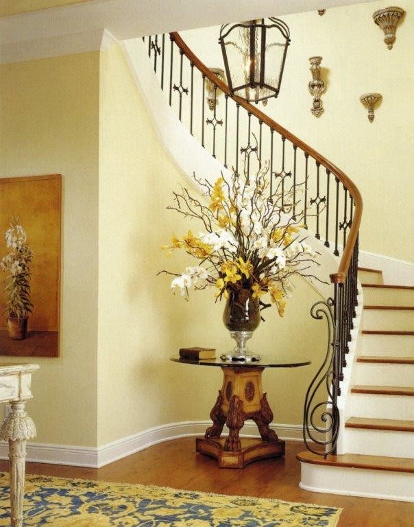 Design ideas for a medium sized mediterranean wood curved staircase in Orlando with painted wood risers.