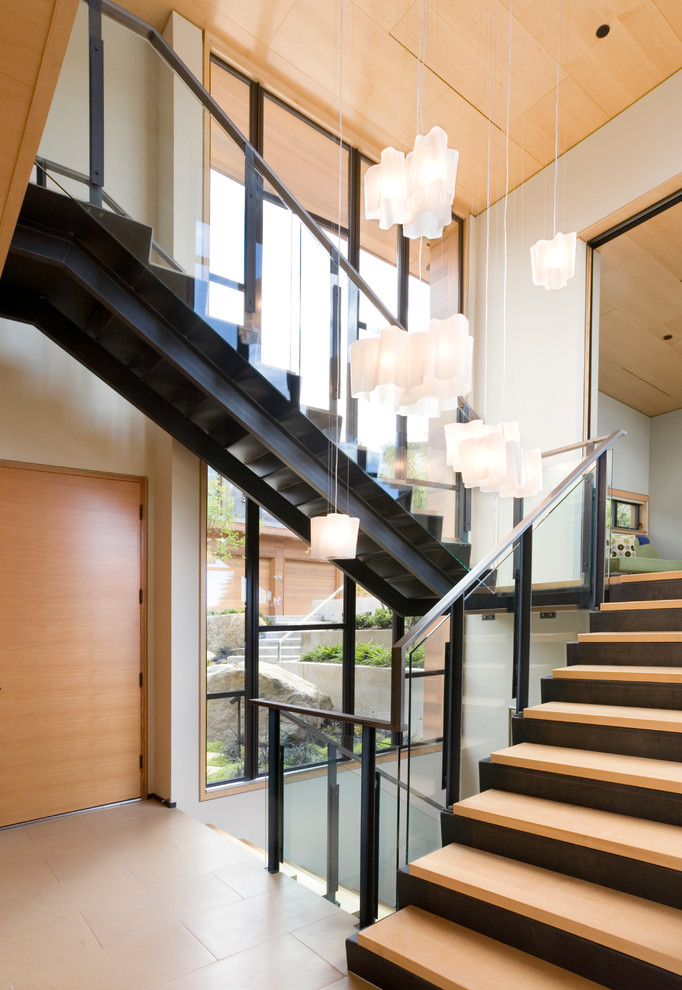 Staircase - contemporary wooden staircase idea in Seattle