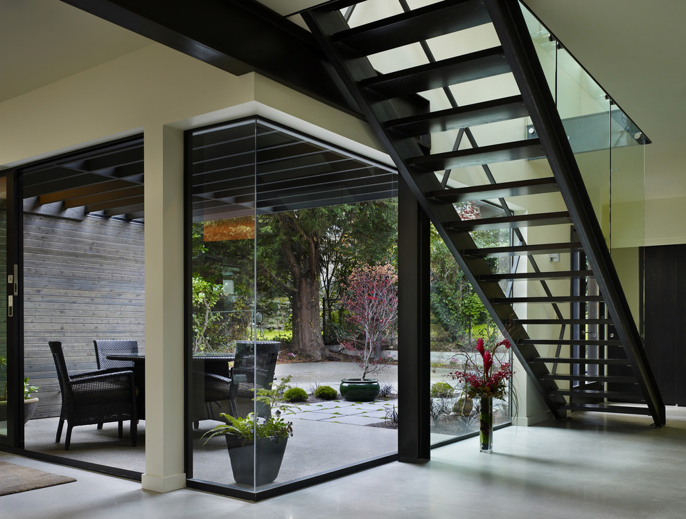 Modern straight staircase in Seattle with open risers.