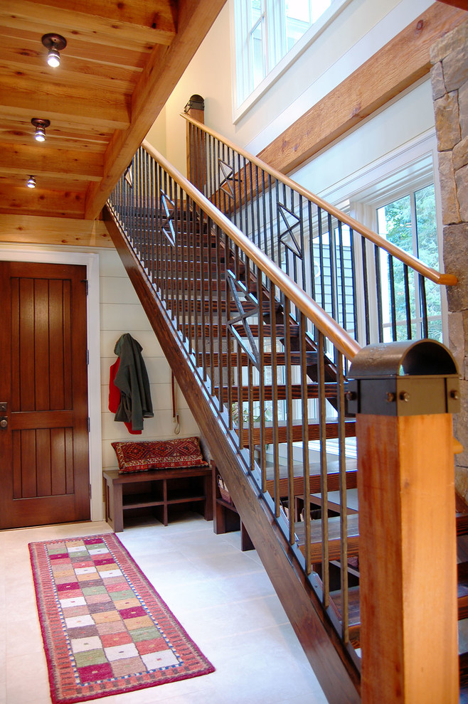 Example of a mid-sized arts and crafts wooden straight staircase design in Grand Rapids with wooden risers