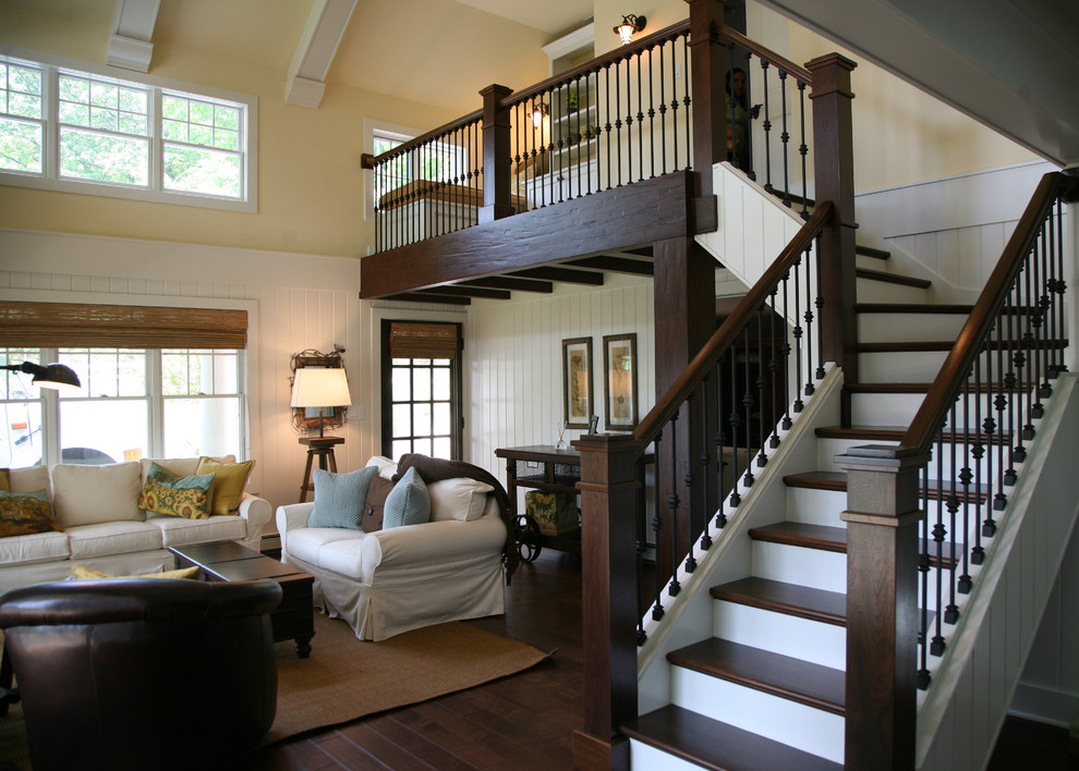 Design ideas for a medium sized traditional wood l-shaped metal railing staircase in Milwaukee with painted wood risers.