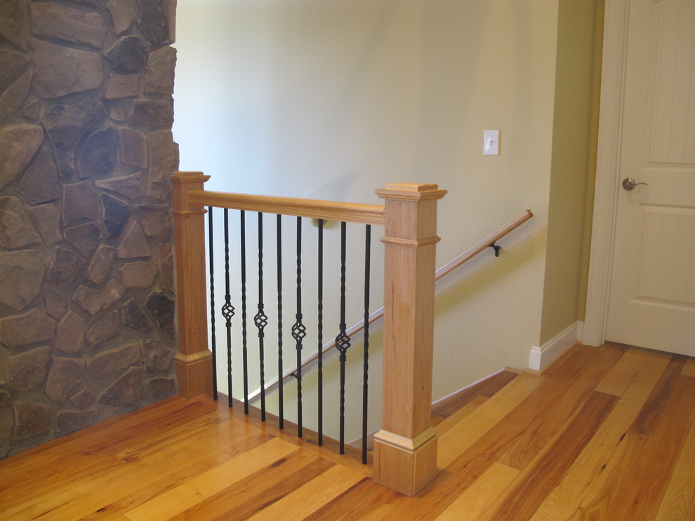 Medium sized classic wood straight staircase in Detroit with wood risers.