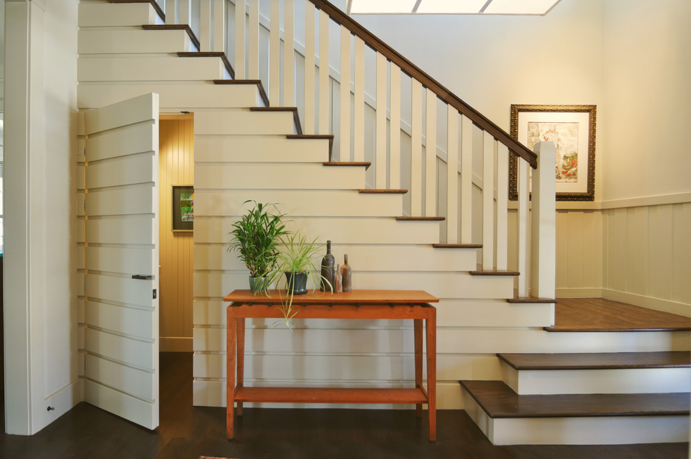 Inspiration for a traditional wood l-shaped staircase in Other with a dado rail.