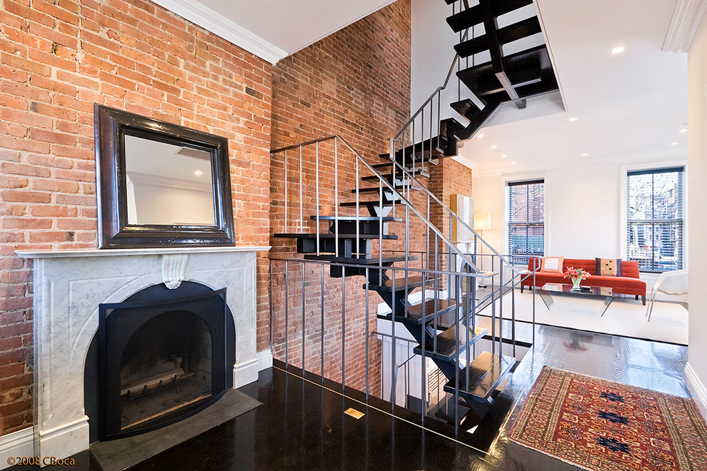 Photo of a medium sized contemporary wood floating staircase in New York with metal risers.