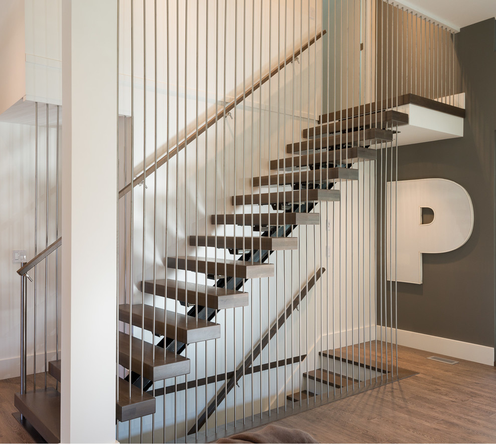 Contemporary wood straight staircase in Vancouver with open risers.