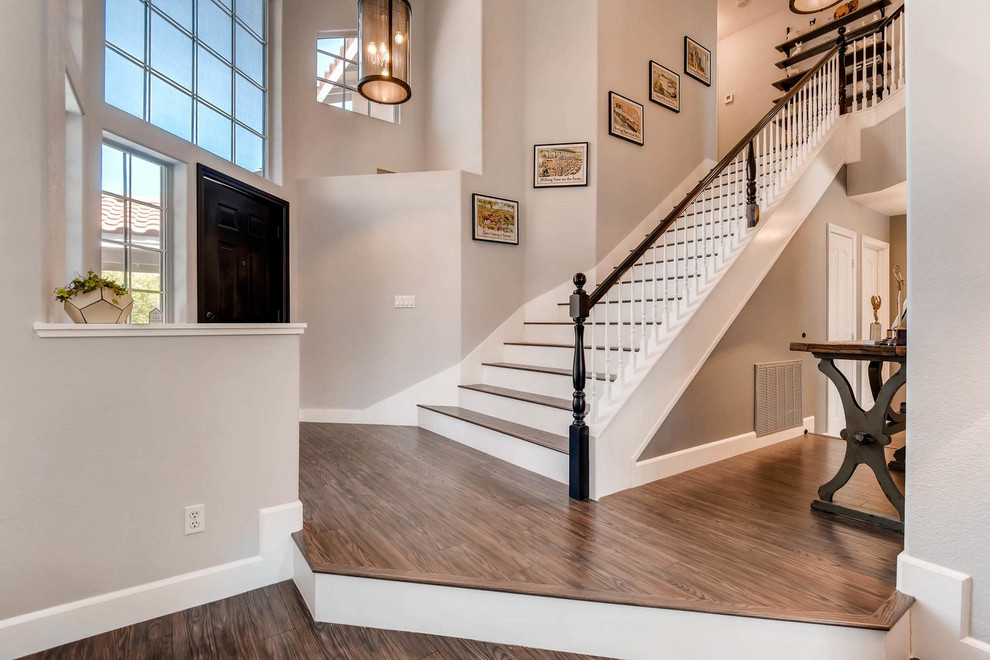 Inspiration for a large straight wood railing staircase remodel in Las Vegas with wooden risers